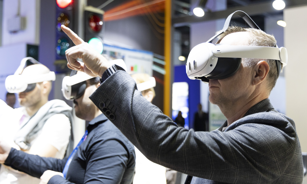 Image of delegates trying AR/VR headsets in the exhibition area