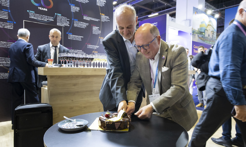 An image of Angelos Amditis - Chairman of ERTICO and Joost Vantomme cutting a 35 year celebratory cake at the ITS European Congress in Istanbul 